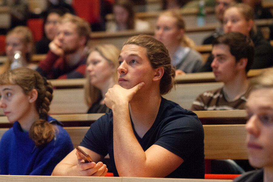 Students looking to the left in the direction of the teacher