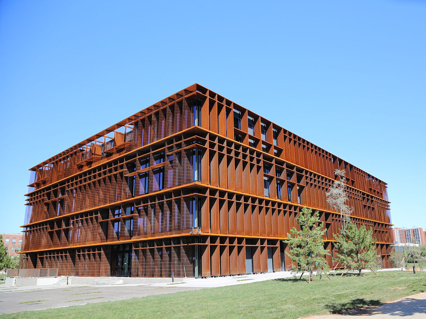 Sino-Danish Center, a big Brown Chinese buildingand a clear, Blue sky